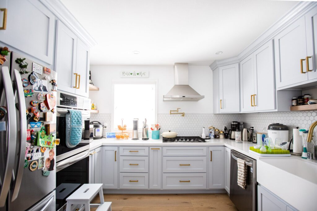 Bright kitchen remodel with white cabinets and brass hardware
