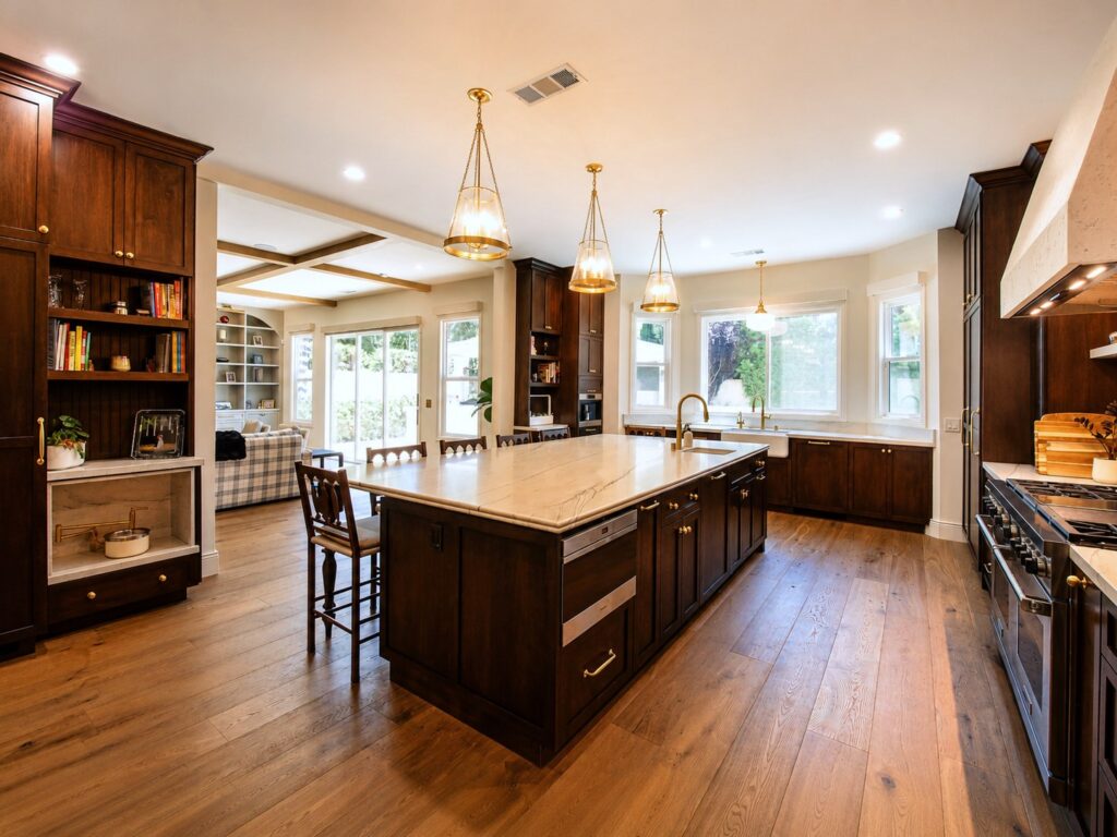 Kitchen with dark wood cabinetry and large island in the Loch Lomond home renovation